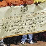 BMWU members with banner standing outside Government building in Gaborone on 6 July 2016