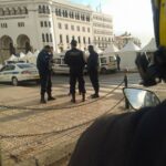 Police stand guard outside the central post office in Algiers, ahead of the demonstration on 20 January.