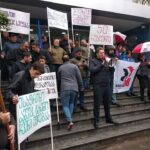 The union pickets outside the company office in April