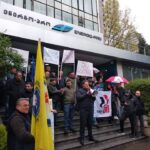 The union pickets outside the company office in April