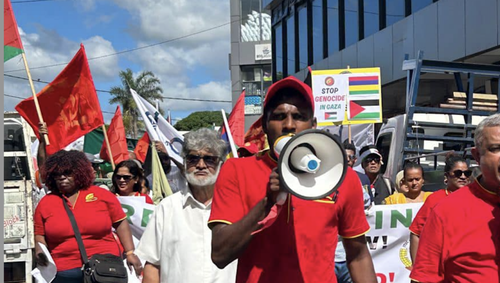 Shayn Ishwaren at a demo in Mauritius to stop the genocide in Palestine. Credit: CTSP
