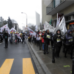 Women march on the streets of Warsaw protesting against plans to close four mines.